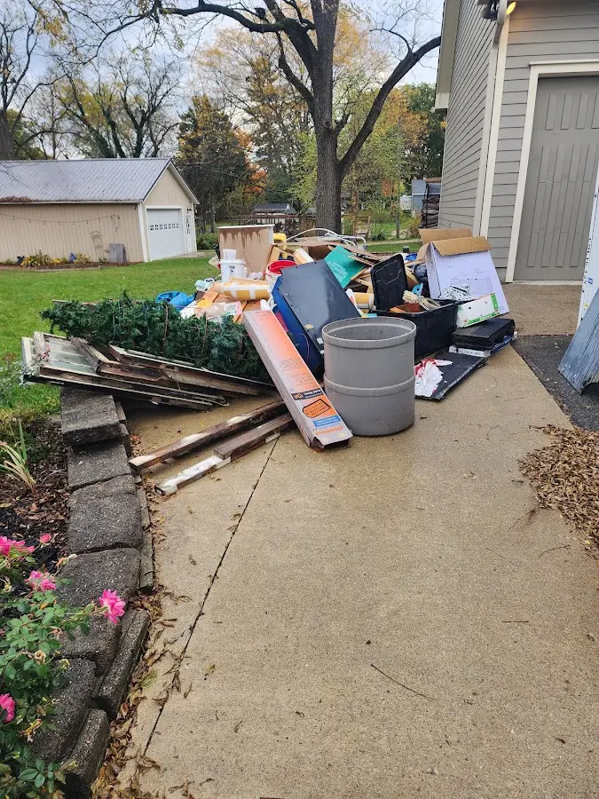 Dumpster being loaded with debris for Estate Cleanout Dumpster Rental in Towamencin